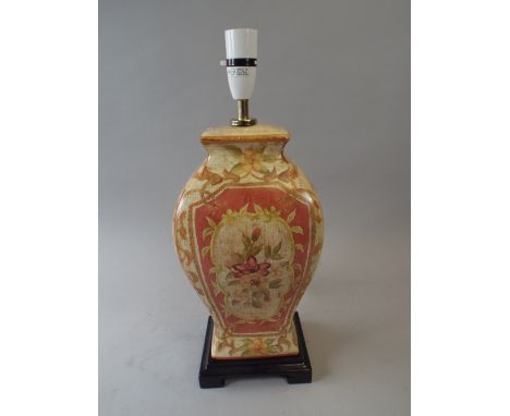 A Ceramic Table Lamp with Floral Decoration.