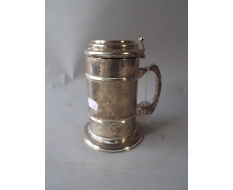 A Silver Lidded Tankard with Heraldic Boar's Head Device with the motto 'Reddens Laudes Domino'. Monogrammed Either Side C & 