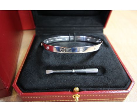 Cartier 18ct white gold 'Love' bangle set with six diamonds each approx 0.10, size 17, No. F01273, with screwdriver and prese