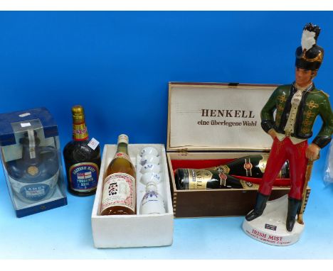 A Lamb's Navy Rum ceramic decanter and contents, boxed; a Sakura-Masamune Japanese bottle of sake with server and 4 cups, box