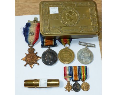 A WWI 1914 star trio of medals with a set of miniatures; a WWII Defence medal to MI-9707 Pte A Gledhill, A.S.C.; a Christmas 