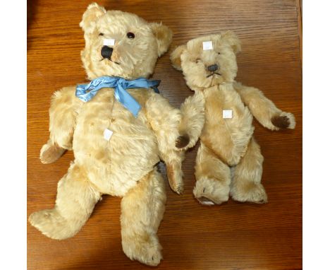 A large early/mid-20th century Chiltern teddy with amber eyes, 19" (worn); a similar teddy, 14"