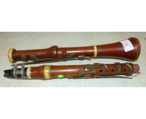 A pear wood and ivory clarinet signed Wood and Ivy