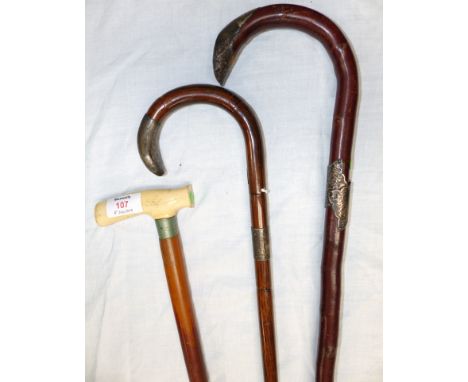 An ivory handled walking stick and 2 others