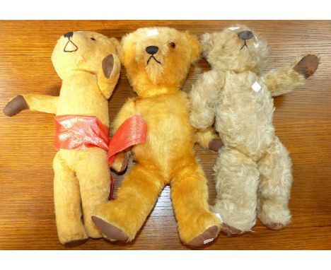 An early/mid-20th century Chiltern teddy with plastic nose, 16" (worn); a similar mid-20th century teddy, 16"; a similar tedd