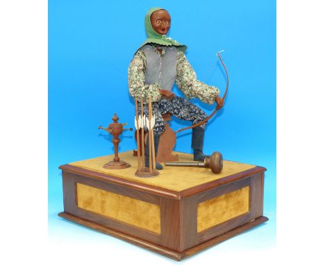 An Automaton Archer by David Secrett with carved yew and fruitwood articulated figure in leather tunic and hood, the wooden f