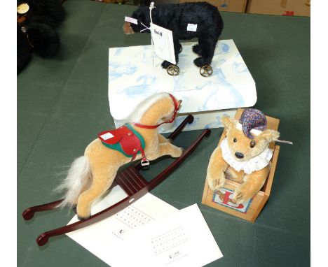 A modern Steiff originally boxed black bear on wheels, with certificate; a Steiff rocking horse with certificate; a modern Ja