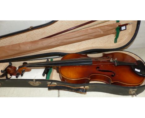 A mid-20th century Stradivarius pattern violin, 14 1/8" back, and 2 bows, cased, unlabelled