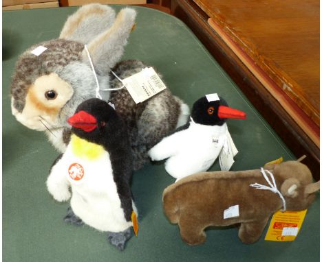 A modern Steiff rabbit; 2 penguins, and "Bessie"
