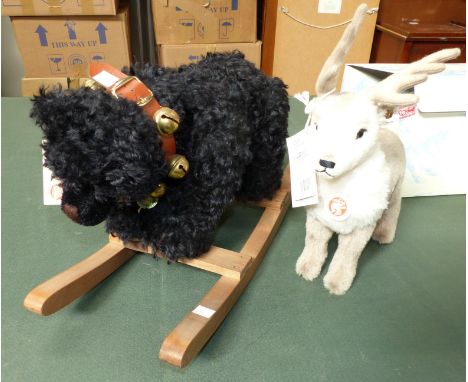 A modern Steiff originally boxed reindeer with certificate; a similar rocking black bear (unboxed)