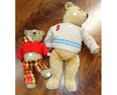 A large 1930's Chiltern teddy in woollen jumper; a smaller Chiltern teddy in check trousers