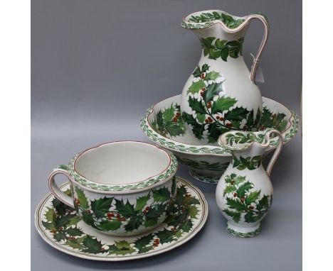 A Victorian Copeland toilet set comprising jug and basin, chamber pot, small jug and a circular tray.Each decorated with holl