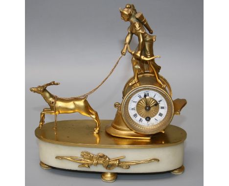 A late 19th century gilt metal and alabaster boudoir timepiece, the drum cased eight day movement with Roman enamel dial surm