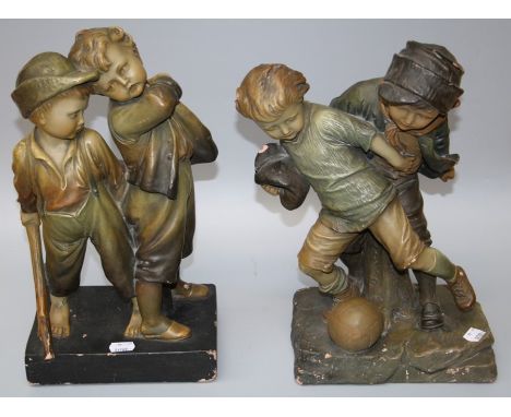 A 1920s probably Austrian painted terracotta figure group of street urchins playing soccer. Bearing indisitinct , Schutt trad
