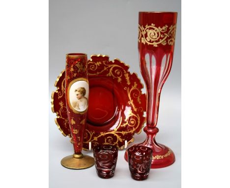 An early 20th century cranberry and gilded glass vase decorated with a painted enamel plaque of a child, together with a Bohe