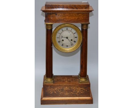 A Charles X, eight day, satinwood strung and marquetry inlaid rosewood portico clock with with decorative embossed pendulum a