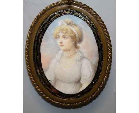 In the manner of William Armfield Hobday. A 19th century three quarter, oval portrait miniature on ivory of Lady Colbourne, d