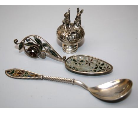 A probably Norwegian silver and plique a jour cabinet spoon marked 925. Together with a white metal and plique a jour scroll 