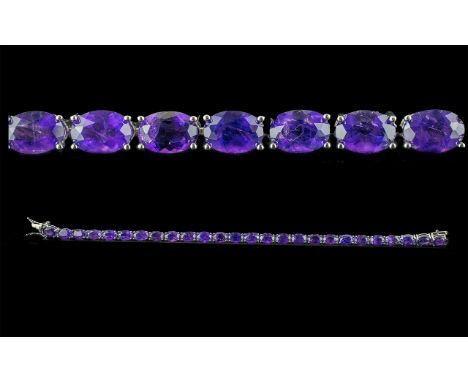 Deep Purple Amethyst Tennis Bracelet, rich purple, oval cut amethysts, set in a line, totalling over 18cts. measuring 8 inche