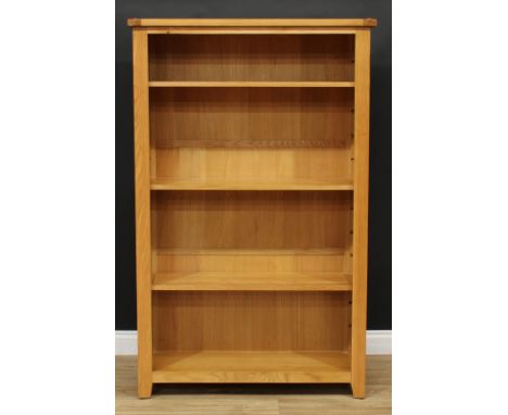 A contemporary light oak open bookcase, three adjustable shelves, 157cm high, 99cm wide, 32cm deep 
