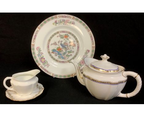 A Royal Crown Derby Carlton Blue pattern teapot, first quality; a milk jug, a saucer; a Wedgwood Kutani Crane pattern dinner 