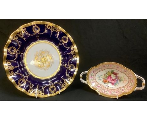 A Royal Crown Derby shaped oval two-handled tray, The 250 Collection, printed with floral sprays within a gold border, limite