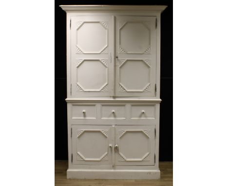 A painted pine housekeeper's cupboard, moulded cornice above a pair of panel doors enclosing an adjustable shelf, the base wi