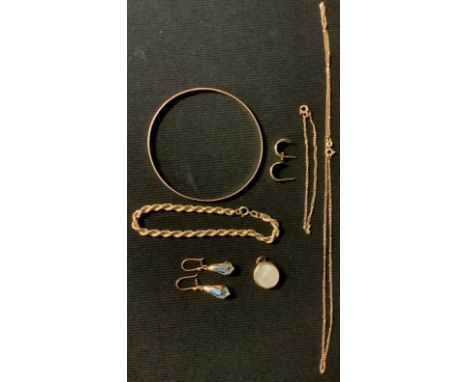 A 9ct gold necklace, a 9ct gold bangle, a 9ct gold rope twist bracelet, a 9ct necklace and bracelet set, 9.1g; a fob, two pai