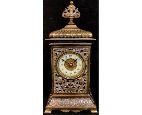 A Victorian brass mantel clock, pierced case cast with owls and scrolling foliage, 25cm high 