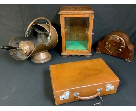 A 20th century oak glazed smokers cabinet, 43cm high, c.1930;  an oak mantel clock, c.1935;  a copper fuel bin and scoop;  a 