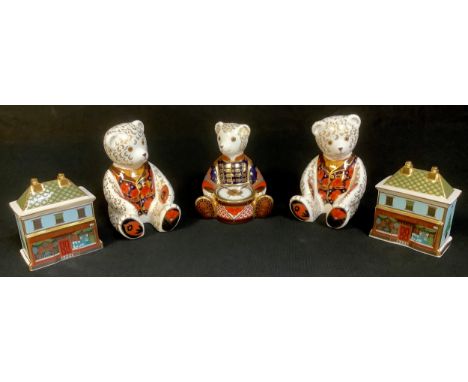 A Royal Crown Derby paperweight, Drummer Teddy, silver stopper, second, printed mark; two others Teddies, no stoppers, second