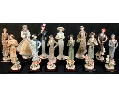 A collection of twelve Giuseppe Armani Florence figures including December Magic, Daffodil, Daisy, Carnation, Bluebell, Rose,