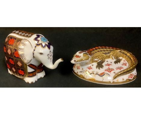 A Royal Crown Derby paperweight, Imari Baby Elephant, trunk raised, no stopper, second, 10cm, printed mark; another, Crocodil