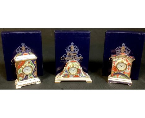 A Royal Crown Derby Kimono pattern miniature mantel clock, 8cm, first quality, boxed; two others, Arita and Haiku pattern, bo