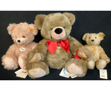 Steiff (Germany) 660917 teddy bear, trademark Steiff button to ear with red and yellow tag, 27cm high; other Steiff teddy bea