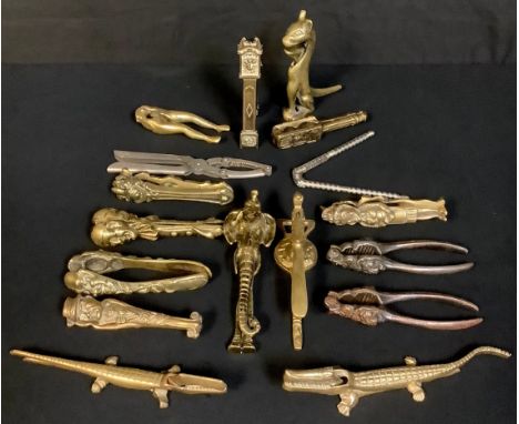 A novelty gilt-brass lever-action table-top nutcracker, as a crocodile, 20.5cm long, 20th century; other novelty nutcrackers,