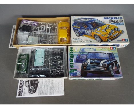 Tamiya - Two boxed 1:24 scale plastic model car kits by Tamiya. Lot includes Tamiya #130 Morris mini Cooper; and #153 Micheli