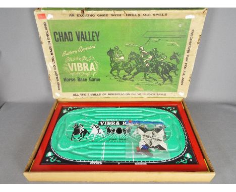 Chad Valley - Vibra Horse Race Game in Good condition. Contains 4 horses and a wheel in original box. 
