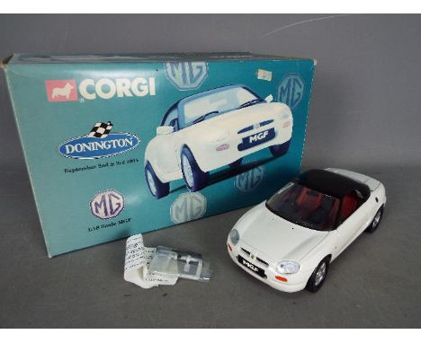 Corgi - Boxed 1:18 scale Corgi MGF model complete with it's mirrors and aerial still in the box unfitted. The car is Mint con