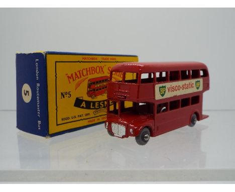 Matchbox - A boxed Matchbox #5 London Routemaster Bus (66mm). The model in red with red base, grey 18 tread plastic tyres, do