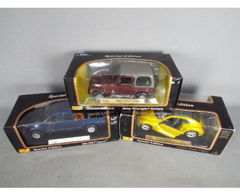 Maisto - Three boxed 1:18 scale 'Special Edition' diecast model cars from Maisto. Lot includes Maisto #31662 Jeep Wrangler Sa