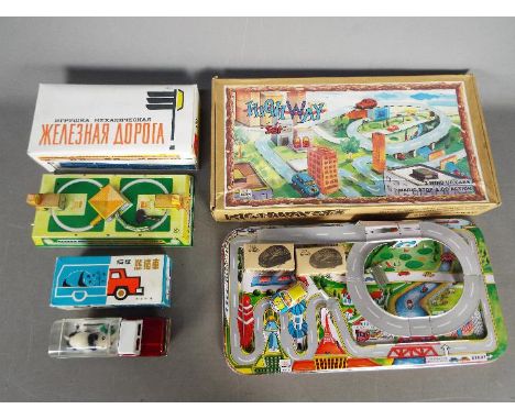 Tinplate Toys - Three boxed tinplate toys. Lot consists of a Welby 'Highway Set'; with a boxed Russian made Mechanical Railwa