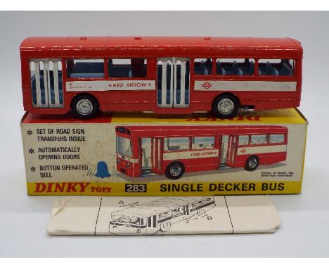 Dinky Toys - A boxed Dinky Toys #283 Single Decker Bus. The model in red with 'Red Arrow' white decals, pale blue interior an