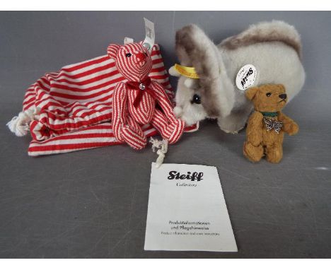 Steiff Bears - a Steiff Brown Bear with butterfly necklace and button in ear, a Steiff Teddy Bear #035838 with dust bag, whit