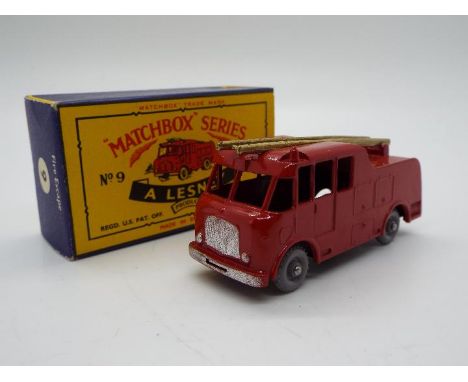 Matchbox - A boxed Matchbox #9 Merryweather Marquis Fire Engine. The model in red with front only silver trim, has 24 tread g