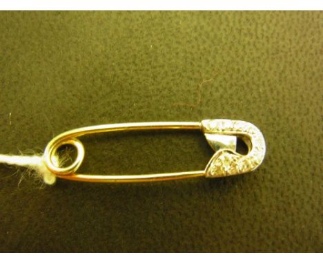 A diamond safety pin - Set with brilliant-cut diamonds Length 3cms - Weight approx 1.2gms 
Condition Report: Good - With some