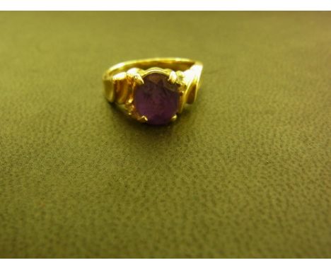An amethyst and diamond ring - Stamped 585 - Ring size I - Weight approx 4.3gms
Condition Report: Good to fair - With light s