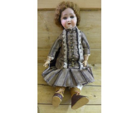 A Schoenall and Hoffeister bisque head Doll - 1909 - 2 with sleeping blue eyes, open mouth showing two teeth, light brown wig