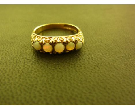 A 9ct gold opal five-stone ring - Hallmarked Birmingham - Ring size N - Weight approx 3.5gms
Condition Report: Good - With li