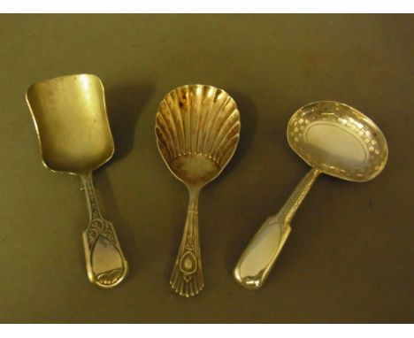 A collection of three silver caddy spoons - A shovel shaped Exeter 1835 - makers mark J.S - John Stone - Length 9 cm, Shell s